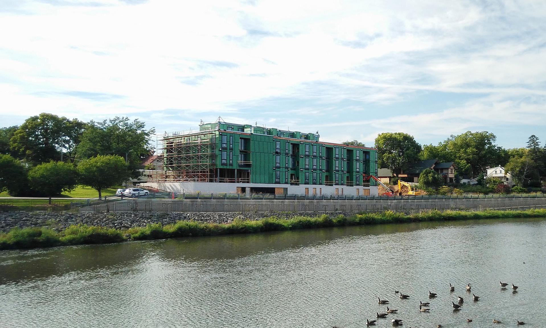 Lofts at Mayo Park exterior from water under construction